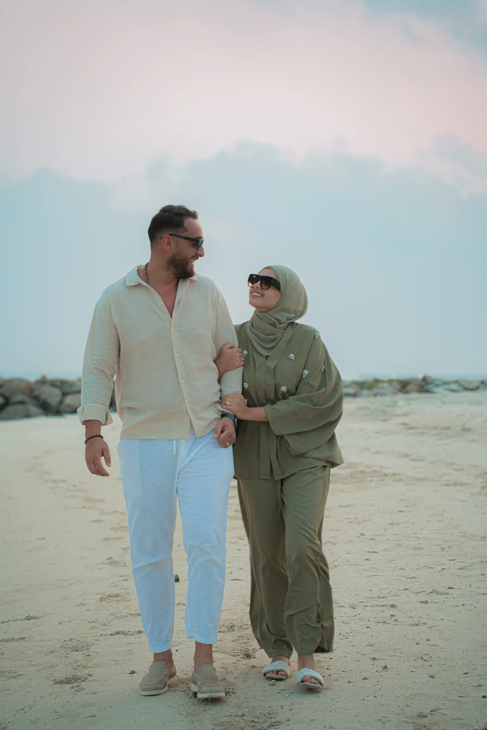 Walking hand in hand along the beach
