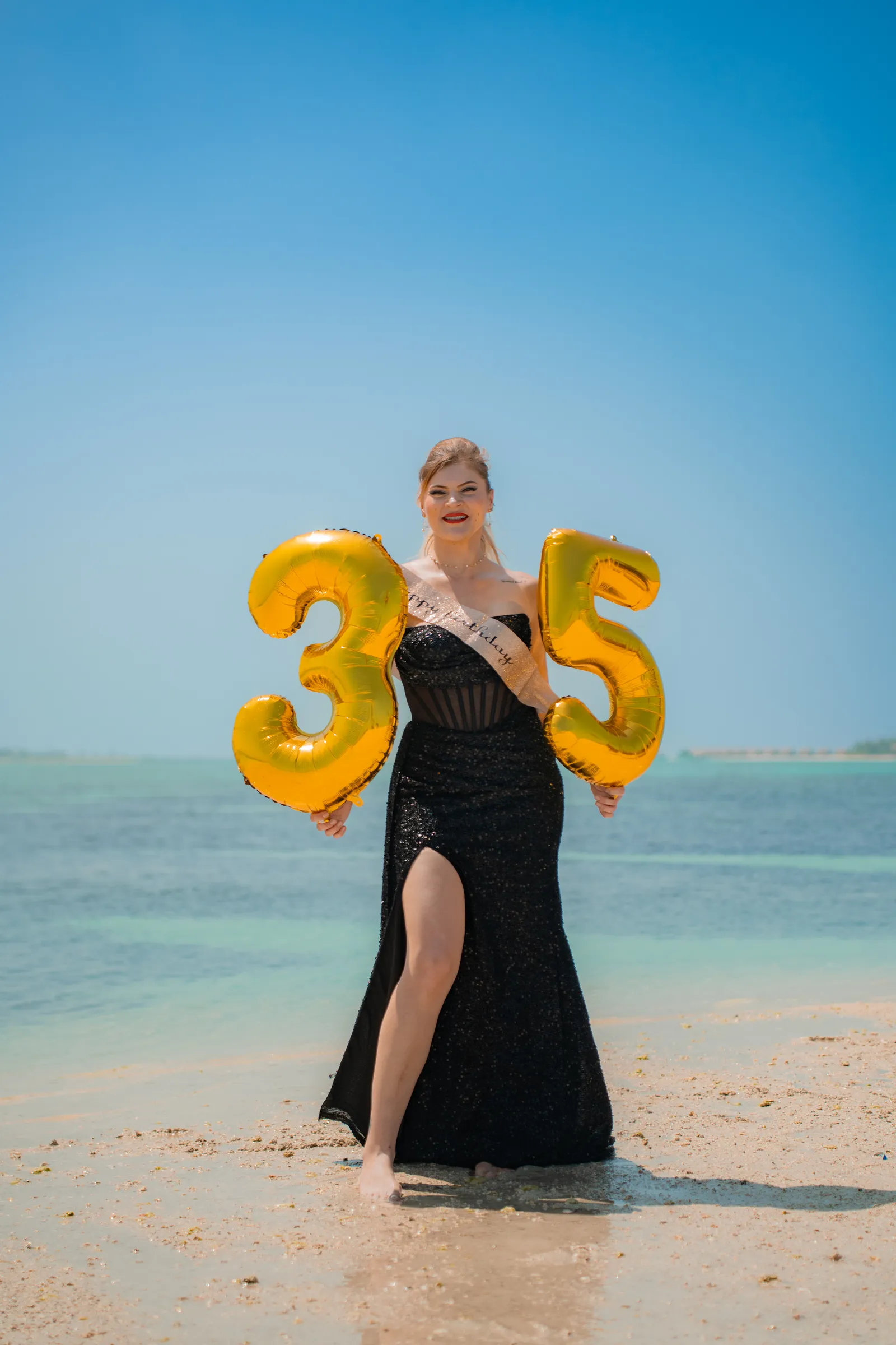 35th-birthday balloons on the beach